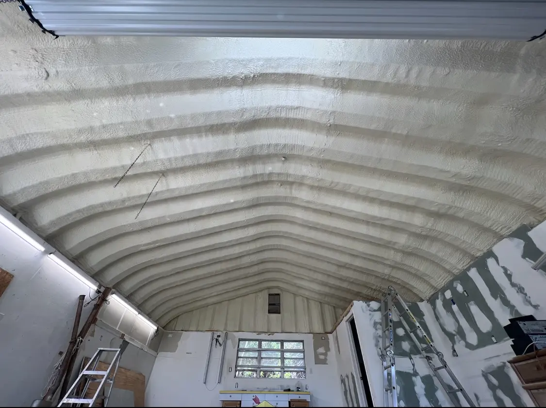 Spray polyurethane foam applied to the underside of a metal roof deck in Groveland